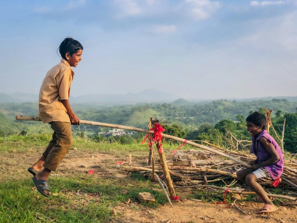 Two children on a seesaw.