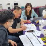 EMBA students working on an assignment