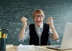Professor going mad in front of a chalkboard